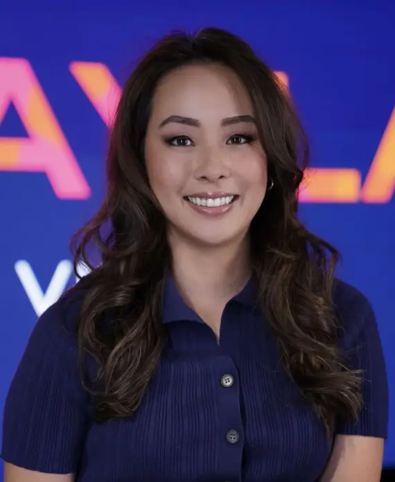 Headshot of a woman in front of a Dizplay backdrop