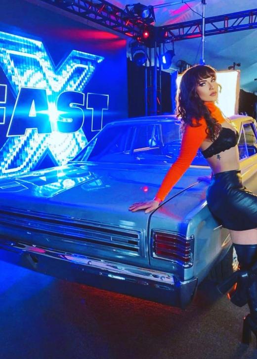Classic car displayed in front of an LED wall