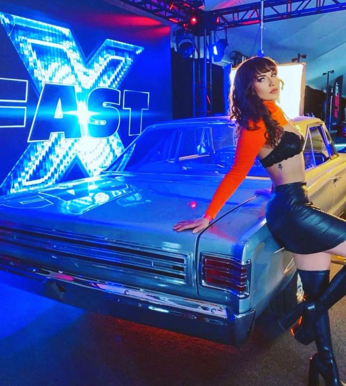 Classic car displayed in front of an LED wall